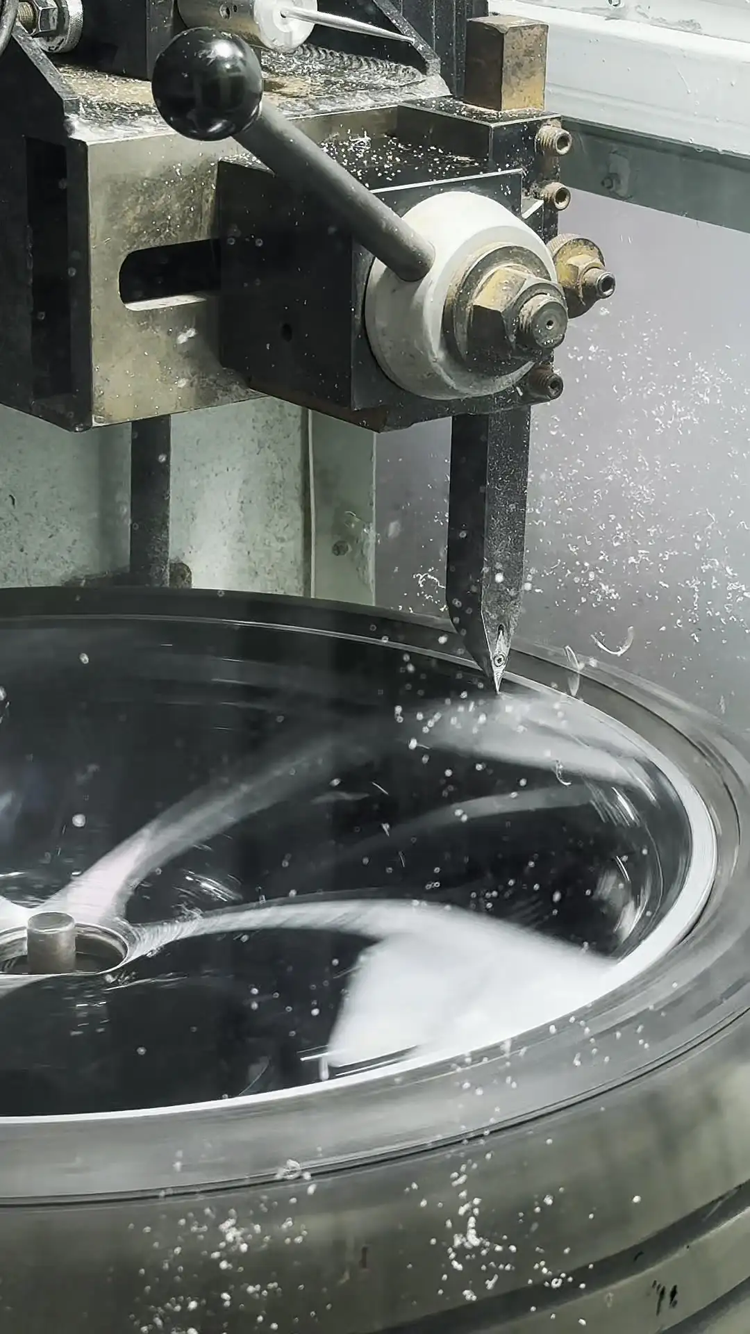 Technician polishing a diamond-cut wheel